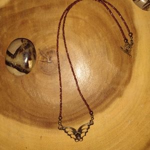 Beautiful  faceted Garnet beads with bronze butterfly